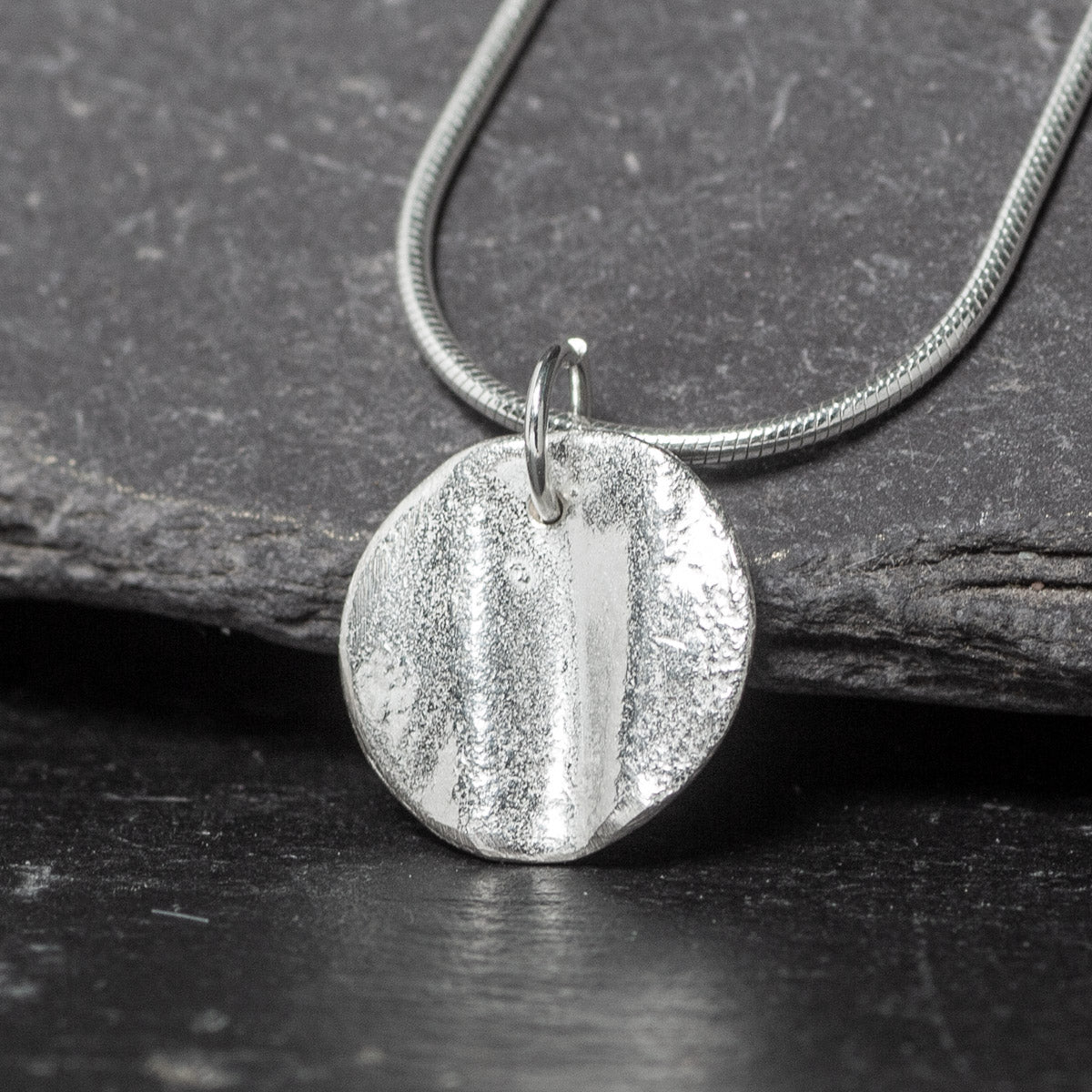 Ribbon Disc Silver Pendant by Silverfish